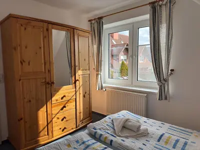 Ein Bett oder Betten in einem Zimmer der Unterkunft Ferienwohnung in Zingst