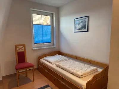 Ein Bett oder Betten in einem Zimmer der Unterkunft Wohnung mit Balkon-nur 500 Meter zum Strand