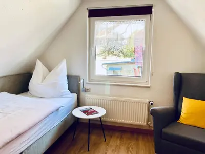 Ein Bett oder Betten in einem Zimmer der Unterkunft Ferienwohnung Kinnerstuw