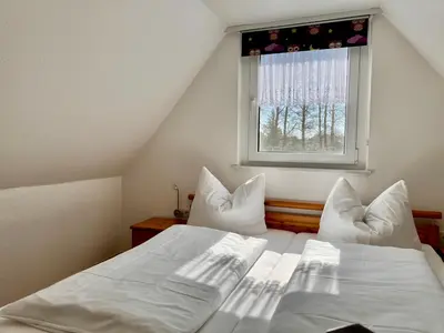 Ein Bett oder Betten in einem Zimmer der Unterkunft Ferienwohnung Wiesenblick