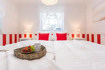 Ein Bett oder Betten in einem Zimmer der Unterkunft Villa Strandblick 9