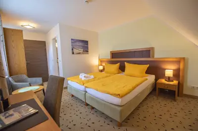 Ein Bett oder Betten in einem Zimmer der Unterkunft Pension Achtern Wieck