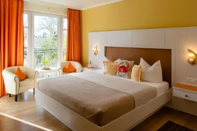 Ein Bett oder Betten in einem Zimmer der Unterkunft Hotel Garni Inselparadies Zingst