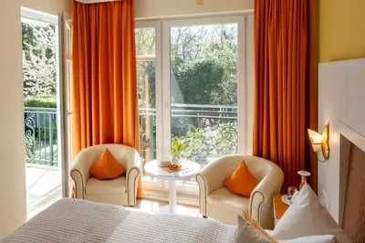 Ein Bett oder Betten in einem Zimmer der Unterkunft Hotel Garni Inselparadies Zingst