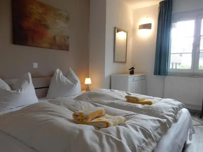 Ein Bett oder Betten in einem Zimmer der Unterkunft Resi P2