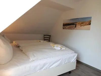 Ein Bett oder Betten in einem Zimmer der Unterkunft Resi A5