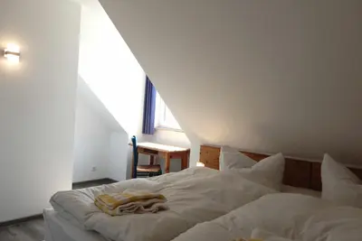 Ein Bett oder Betten in einem Zimmer der Unterkunft Resi A6