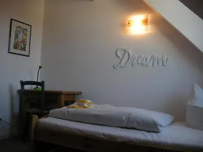 Ein Bett oder Betten in einem Zimmer der Unterkunft Resi F7