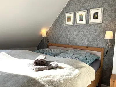 Ein Bett oder Betten in einem Zimmer der Unterkunft Kormoran Muschelsucher