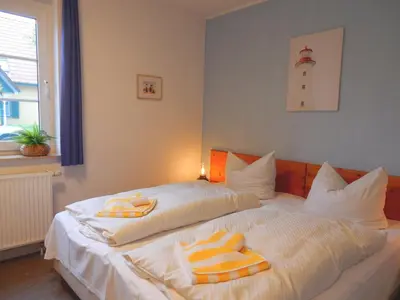 Ein Bett oder Betten in einem Zimmer der Unterkunft Gästehaus Whg 1