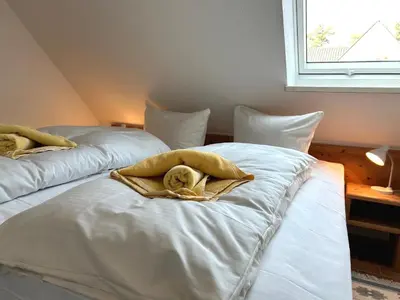 Ein Bett oder Betten in einem Zimmer der Unterkunft Gästehaus Whg 9