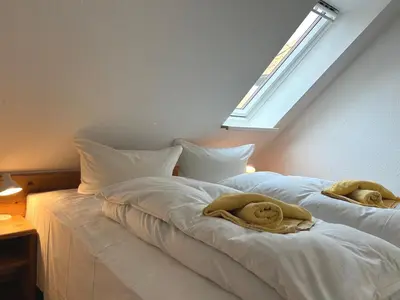 Ein Bett oder Betten in einem Zimmer der Unterkunft Gästehaus Whg 9