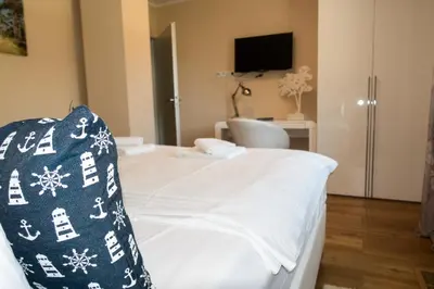 Ein Bett oder Betten in einem Zimmer der Unterkunft Premiumhaus Bodden und Mehr-Brise