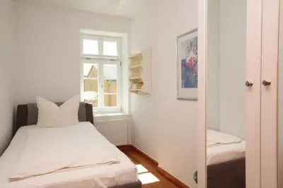 Ein Bett oder Betten in einem Zimmer der Unterkunft Gästehaus Schimmel´s