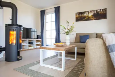 Ein Sitzbereich in der Unterkunft Ferienhaus Schilfrohrsänger 6