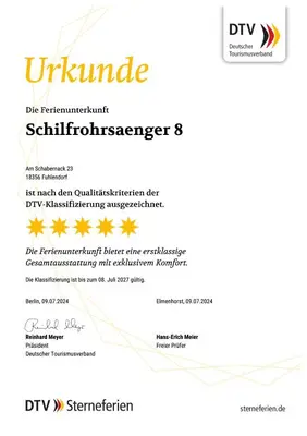Ein Zertifikat, Auszeichnung, Logo oder anderes Dokument, das in der Unterkunft Ferienhaus Schilfrohrsänger 8 ausgestellt ist