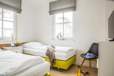 Ein Bett oder Betten in einem Zimmer der Unterkunft Ferienwohnung Düne 2.2