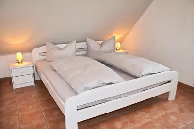 Ein Bett oder Betten in einem Zimmer der Unterkunft Ferienhaus 