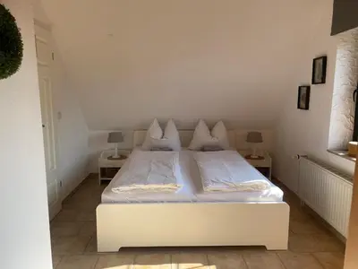 Ein Bett oder Betten in einem Zimmer der Unterkunft Landhaus Schlunt
