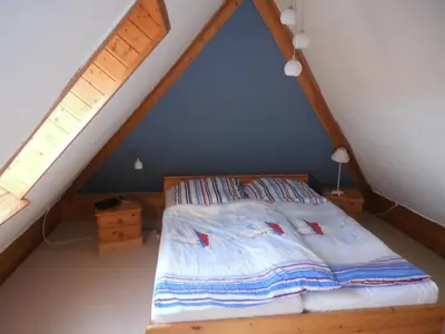 Ein Bett oder Betten in einem Zimmer der Unterkunft Büdnerei 51