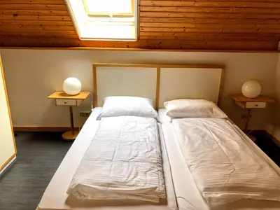 Ein Bett oder Betten in einem Zimmer der Unterkunft Haus am Deich Ferienwohnungen