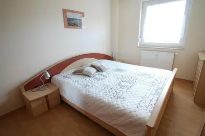Ein Bett oder Betten in einem Zimmer der Unterkunft Ostseeglück App9