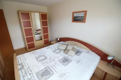 Ein Bett oder Betten in einem Zimmer der Unterkunft Ostseeglück App9