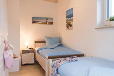 Ein Bett oder Betten in einem Zimmer der Unterkunft Strandhaus Lindenstraße