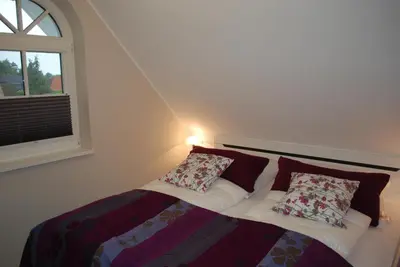 Ein Bett oder Betten in einem Zimmer der Unterkunft Zingst