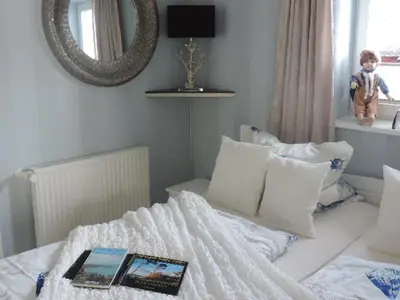 Ein Bett oder Betten in einem Zimmer der Unterkunft Ferienwohnung 