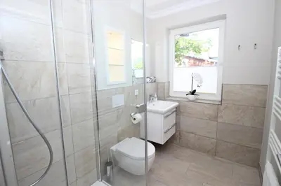 Ein Badezimmer in der Unterkunft KranichSuite - Zingst