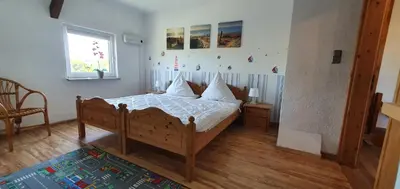 Ein Bett oder Betten in einem Zimmer der Unterkunft Fewo beim Saalerbodden