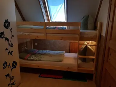 Ein Bett oder Betten in einem Zimmer der Unterkunft Fewo beim Saalerbodden