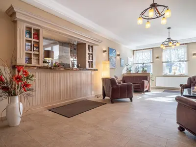 Ein Sitzbereich in der Unterkunft Hotel Stone