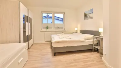 Ein Bett oder Betten in einem Zimmer der Unterkunft Windflüchter - Bucht