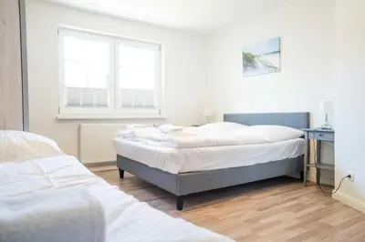 Ein Bett oder Betten in einem Zimmer der Unterkunft Windflüchter - Bucht