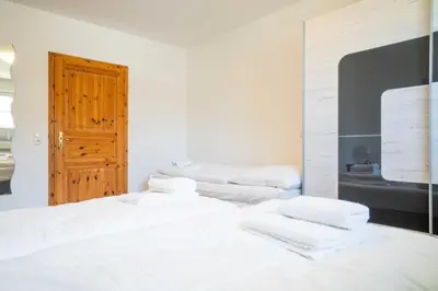 Ein Bett oder Betten in einem Zimmer der Unterkunft Windflüchter - Bucht
