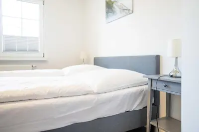 Ein Bett oder Betten in einem Zimmer der Unterkunft Windflüchter - Bucht