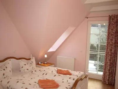 Ein Bett oder Betten in einem Zimmer der Unterkunft Aalkoje Ostseebad Wustrow