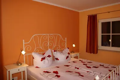 Ein Bett oder Betten in einem Zimmer der Unterkunft Ferienhaus Fischlandperle