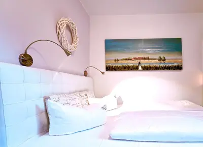 Ein Bett oder Betten in einem Zimmer der Unterkunft Darssmuschel Dierhagen-Strand - Haus 2