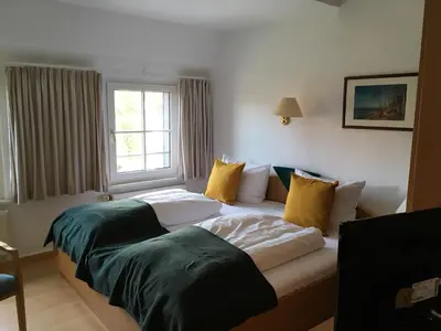 Ein Bett oder Betten in einem Zimmer der Unterkunft Hotel-Pension Seeadler