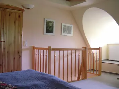 Ein Bett oder Betten in einem Zimmer der Unterkunft Ferienwohnung am Strand