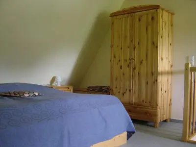 Ein Bett oder Betten in einem Zimmer der Unterkunft Ferienwohnung am Strand