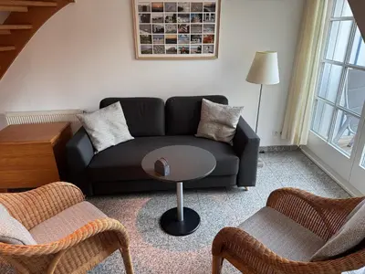 Ein Sitzbereich in der Unterkunft Ferienwohnung am Strand