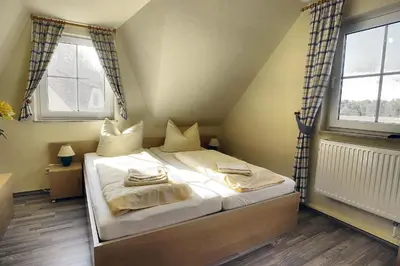 Ein Bett oder Betten in einem Zimmer der Unterkunft Am Deich 50