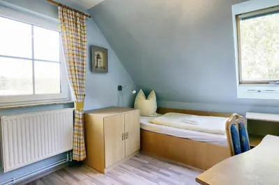 Ein Bett oder Betten in einem Zimmer der Unterkunft Am Deich 50