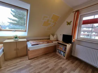 Ein Bett oder Betten in einem Zimmer der Unterkunft Am Deich 22 Strandfalter Zingst