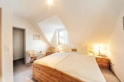 Ein Bett oder Betten in einem Zimmer der Unterkunft Am Deich 20