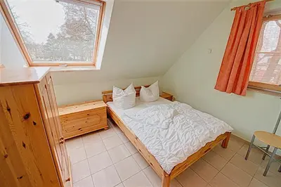 Ein Bett oder Betten in einem Zimmer der Unterkunft Am Deich 09